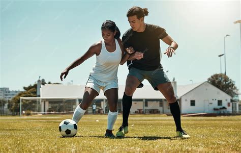 Premium Photo | Man woman and playing soccer on grass park stadium ...