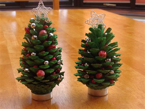 A little Christmas Tree craft project with fir cones, paint and beads ...