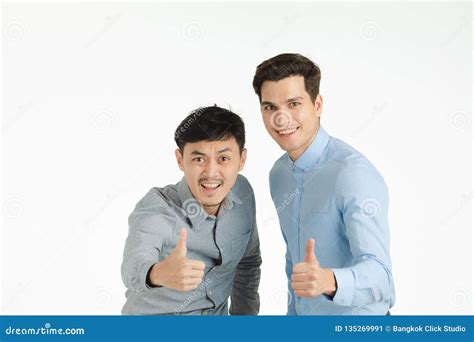 Two men thumbs up pose stock image. Image of bright - 135269991