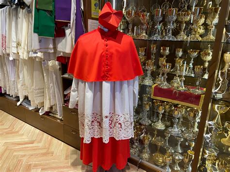 A clergy tailor breaks down the cardinals' red uniform