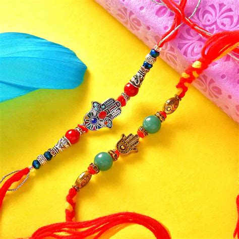 Attractive Set Of 2 Rakhis With Badam Pinni Batisha Slice & Pooja Thal ...