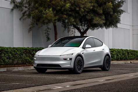 2026 Pearl White Model Y Juniper on 18 inch Off-Road Spec UP-03 in Satin Black