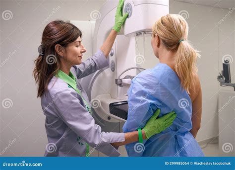 Professional Radiographer Preparing Client for Diagnostic Mammogram Stock Photo - Image of ...