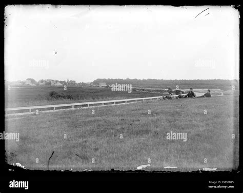 Four men sitting in field , People. Hingham Public Library Glass Slide ...