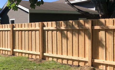 board-on-board wood fence by licensed fence company Miami