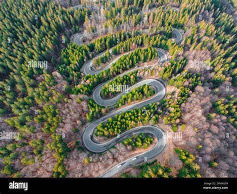 Aerial photography of a winding road in the mountains with serpentines and curves. Photography ...