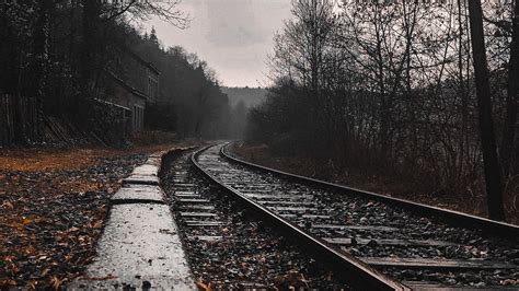 Download wallpaper 1366x768 railway, rails, forest, cloudy tablet ...