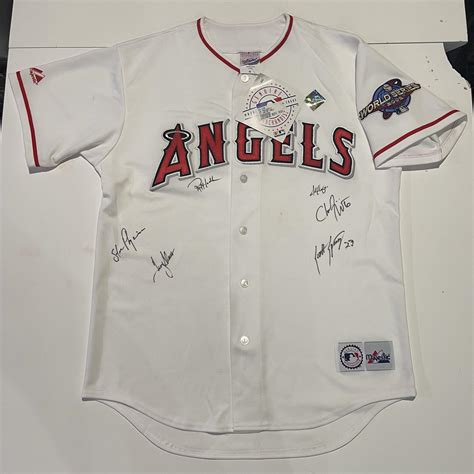 Can anyone ID these signatures from the 2002 Angels team? : r/baseball