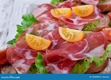 Close-up of Thin Slices of Italian Cold Cut Pork Coppa on Slices of ...