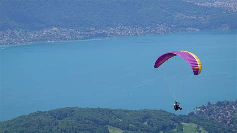 Download wallpaper 2560x1440 man, parachute, sea, aerial view ...