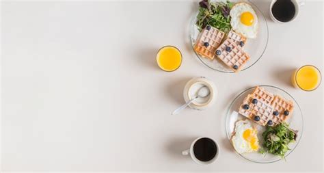 Glass of juice; powdered milk; tea and healthy salad with waffle and ...