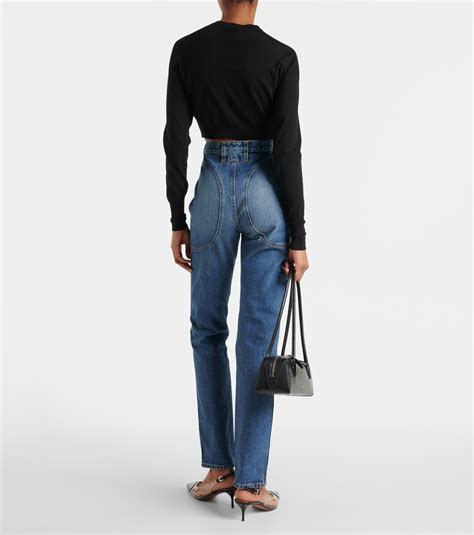 High-rise slim jeans in blue - Alaia | Mytheresa