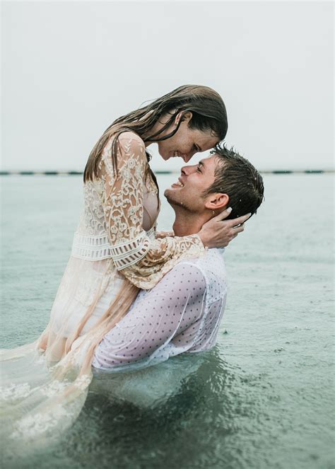 Couple posing in the rain. Notebook kiss. Key West wedding photographer ...