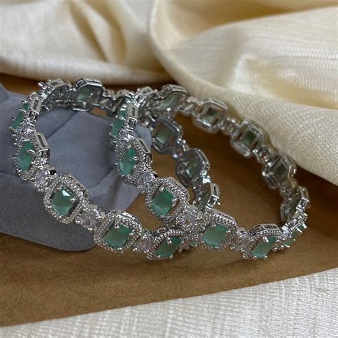 Emerald Elegance – Rhodium-Plated Bangles with CZ and Mint Green Stone ...