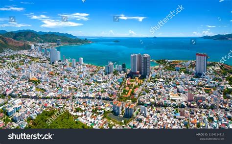 Photograph of Nha Trang beach with many high rise buildings behind it