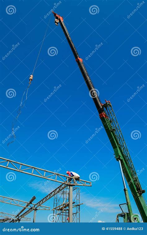 Auto crane on construction editorial stock photo. Image of lifter - 41559488