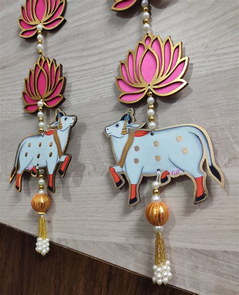 LAMANSH® 22 inch Length Lotus Decorative hangings attached to Holy cow ...