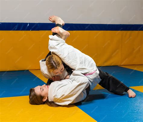 Premium Photo | Young girls practice brazilian jiu jitsu in the gym