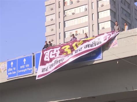 AAP leaders display banner at ITO Flyover to protest against BJP-led ...