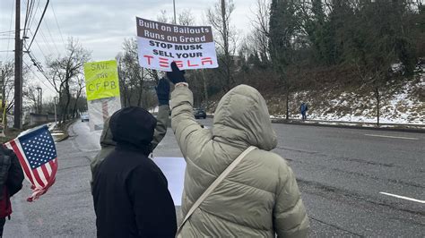 Portlanders rally against Elon Musk, DOGE outside of Tesla dealership | kgw.com