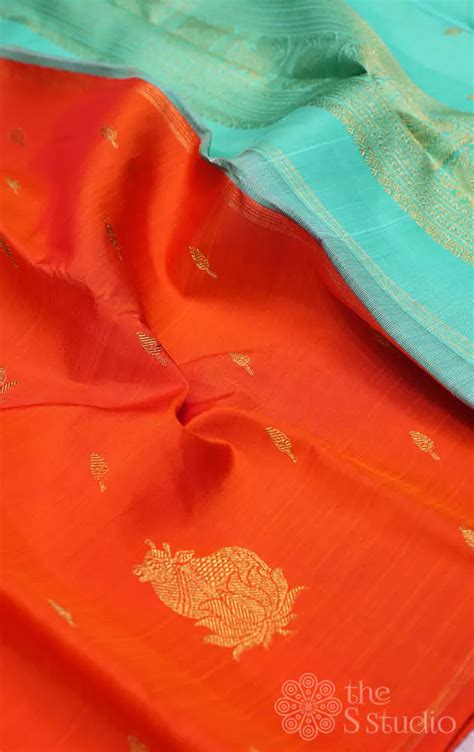 Shop orange kanchipuram silk saree with pichwai cow zari motifs