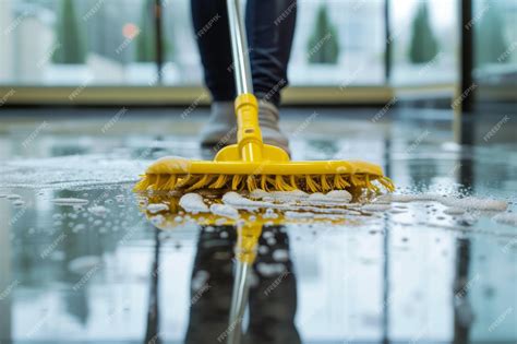 Premium Photo | Closeup of a mop cleaning the floor in a hotel lobby ...