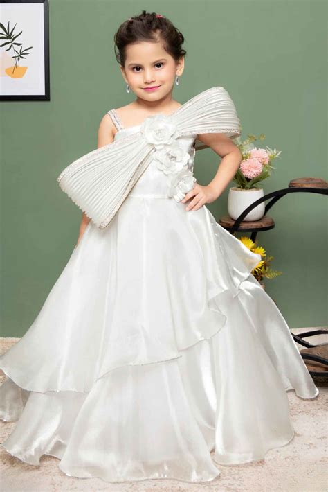 White Party Wear Gown With Floral And Bow Embellishment For Girls ...