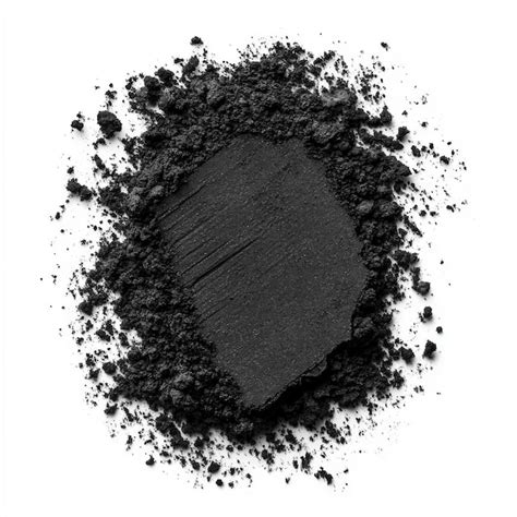 Fine activated charcoal powder in a heap against a white background ...