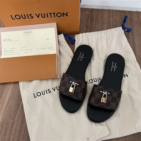 Louis Vuitton Lock Flat mules size 39.5, fits true... - Depop