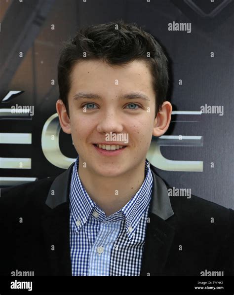 Asa Butterfield arrives at a photo call for the film "Ender's Game" in ...