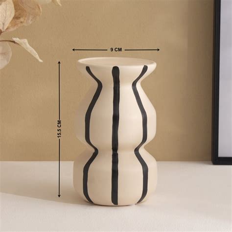 Buy Acroma Est Hae Ceramic Candle Holder from Home Centre at just INR 799.0
