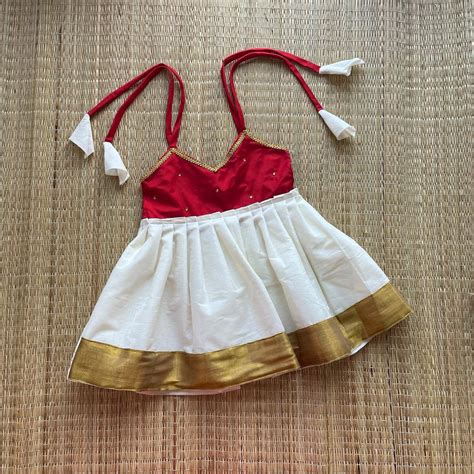 Red & Off White Knot Type Kasavu Frock – Amutham Fashions