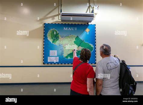 Tourist Look At The Maui Map In The Cruise Ship Terminal In Kahului ...