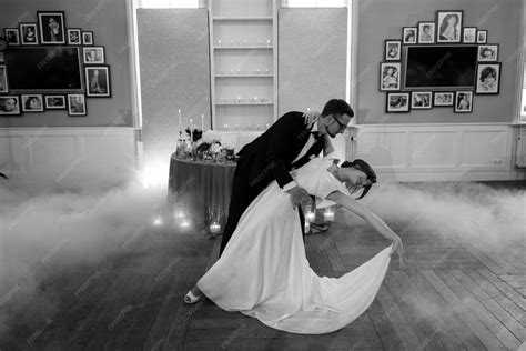 Premium Photo | The first dance of the bride and groom inside a restaurant