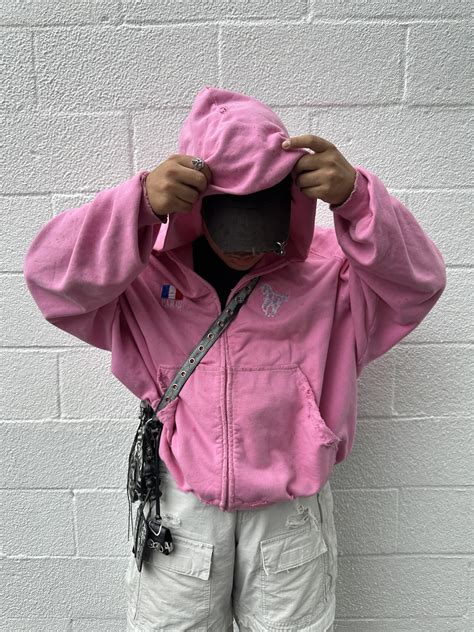 BALENCIAGA distressed hybrid cargos + strike boots + pierced cap ...