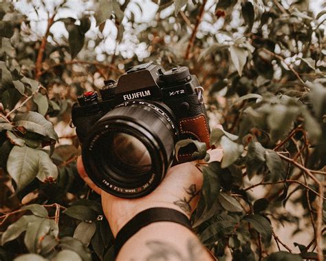 Download wallpaper 1280x1024 camera, arm, tattoo standard 5:4 hd background