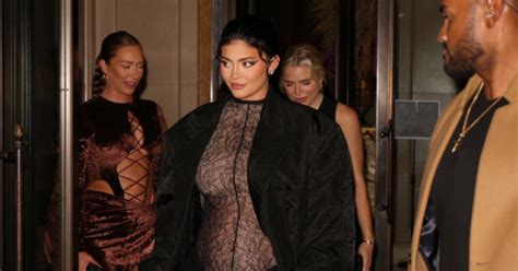 Kylie Jenner shows off her round belly in a sheer dress during New York ...