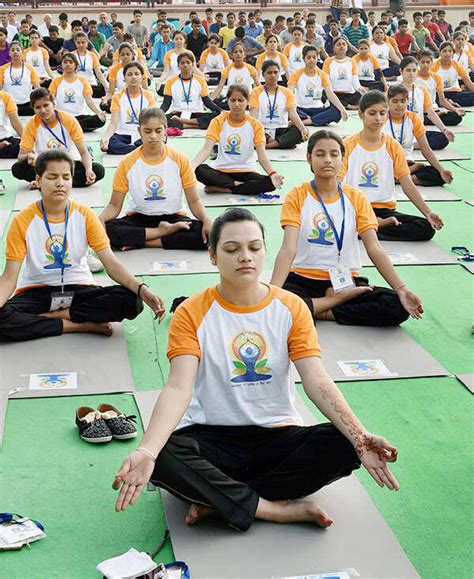 Yoga enthusiasts perform asanas to mark the International Yoga Day at ...