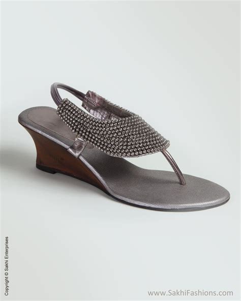 An interesting footwear with intricate beads for a broad patch strap ...