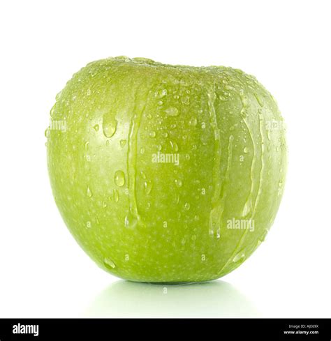 Green Granny Smith apple with water droplets running over it Stock ...