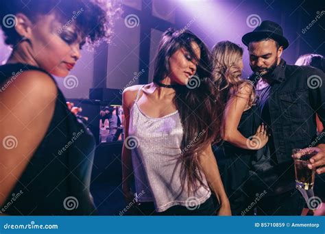 Woman Dancing at Party with Friends at Nightclub Stock Image - Image of ...