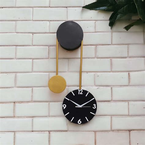 Black & Gold Hanging Dial Metal Wall Clock – Writings On The Wall