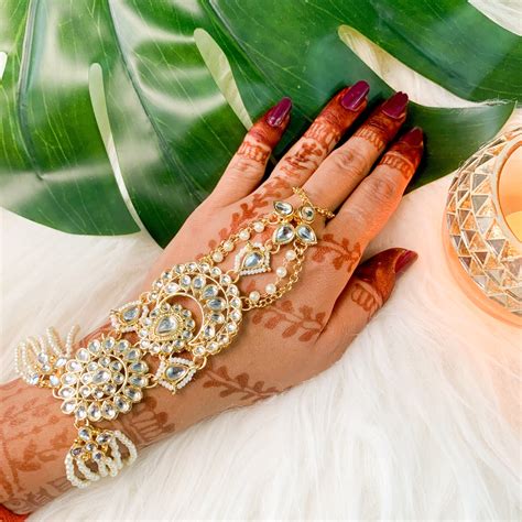 Buy Online Beautiful Gold Plated Hath Phool Online | Panja Bracelet For ...