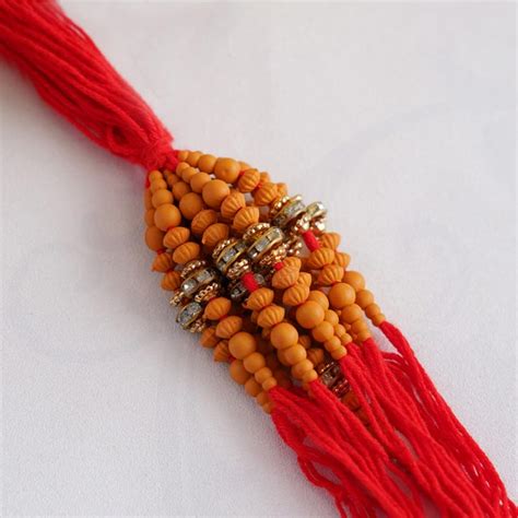 Send Set of 12 Red Beaded Rakhi Online | Rakhibazaar.com