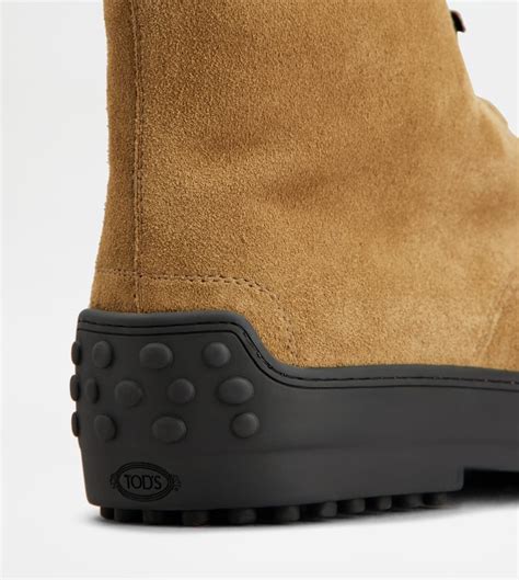 Man BROWN Winter Gommino Ankle Boots in Suede XXM84L0GK60RE06S415 | Tods