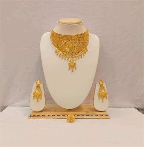 RESHMA, 24 KT GOLD PLATED CHOKER NECKLACE SET WITH ADJUSTABLE FINGER R ...