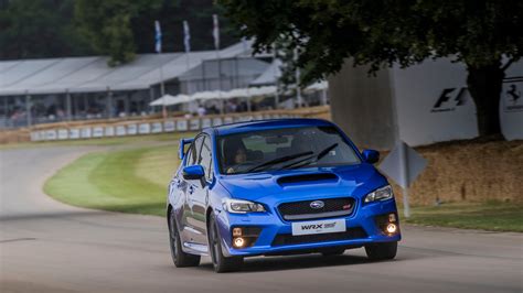 Tackling Goodwood Hill in a right-hand-drive Subaru WRX STI