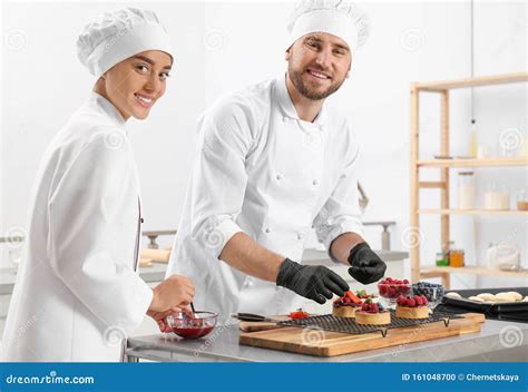Pastry Chefs Preparing Desserts at Table Stock Photo - Image of adult, dessert: 161048700