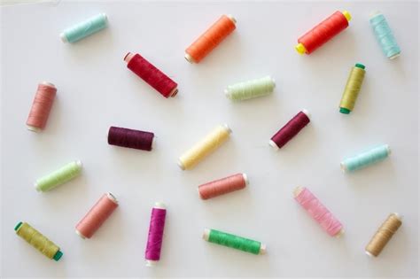 Spools of multicolored threads on a white background copy space ...