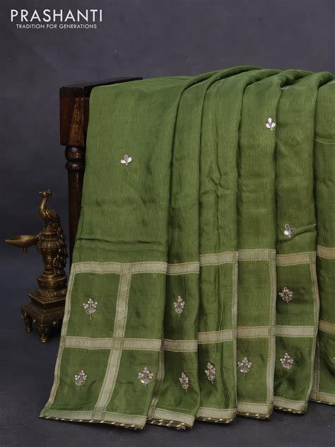 Satin crepe silk saree sap green with mirror work buttas and zari chec ...